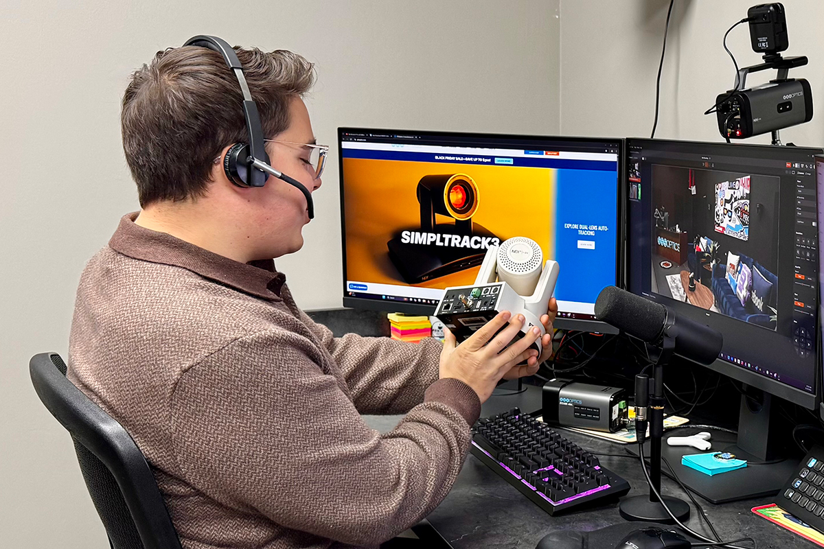 Jon Roberts inspecting a PTZ camera at his work station