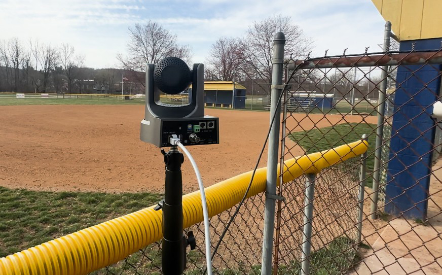 PTZ camera looking over baseball field, back angle