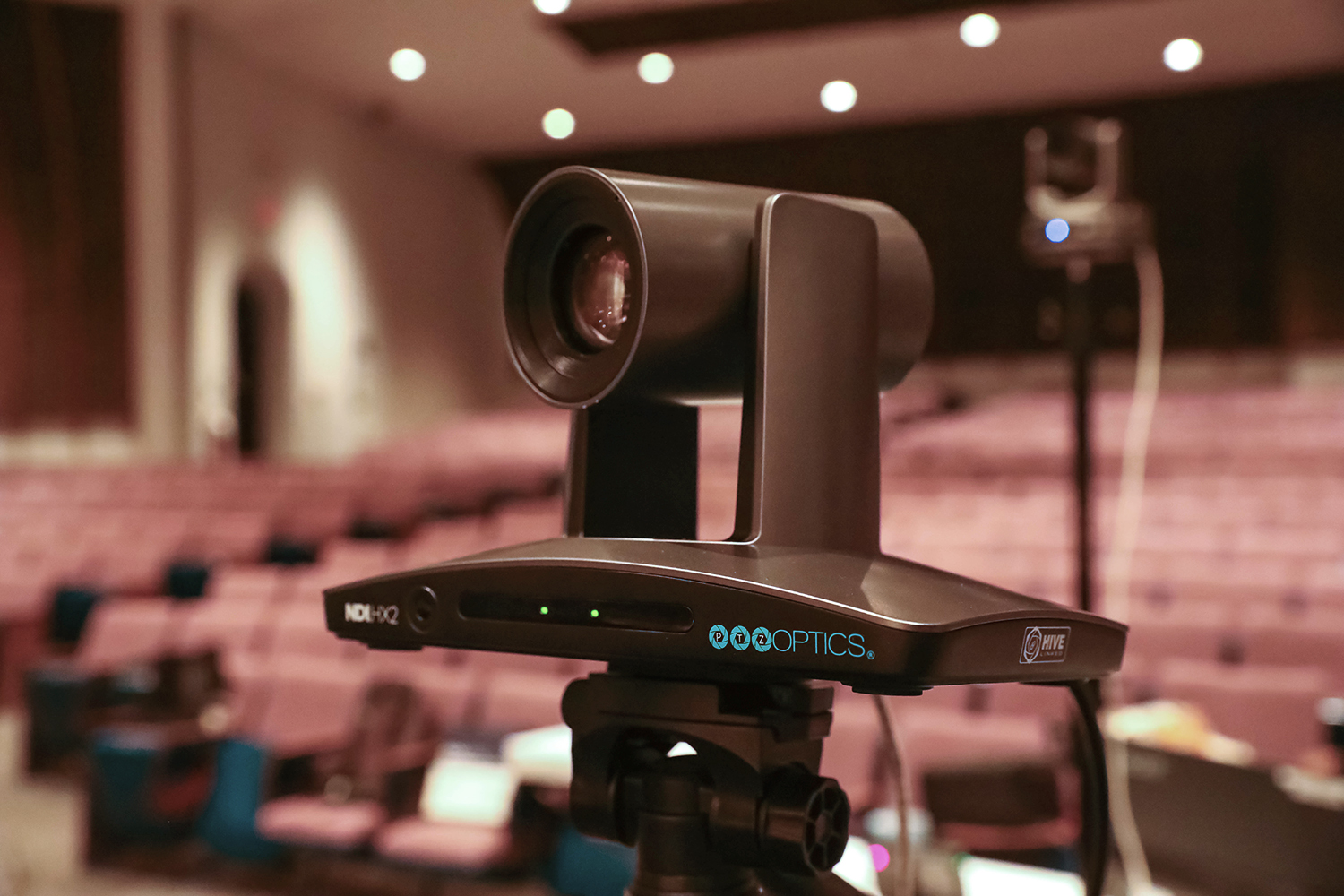 PTZOptics SimplTrack3 in auditorium mounted on tripod